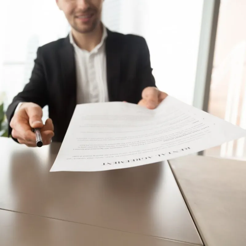 real-estate-agent-offers-sign-rental-agreement_1163-5424